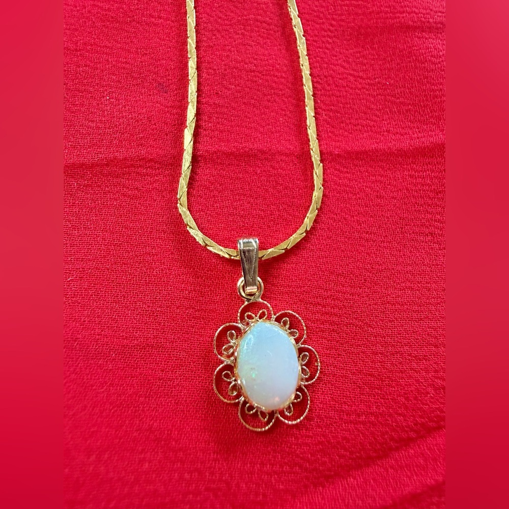 Delicate gold tone necklace with tiny faux opal pendant, thin dainty chain